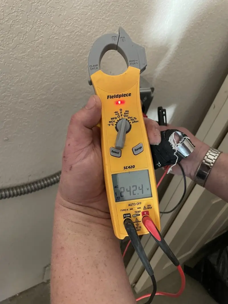 Voltage testing with clamp meter during Electrical Installation Services in Austin